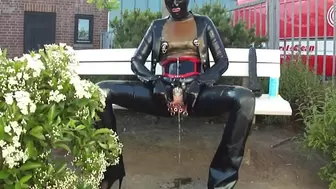 Pierced Plugged Latex Doll Masturbate Monster Rubber Dildo and Pee in Black Jeans Corset Mask Blouse and Gloves Stretched Nipples in Public P2