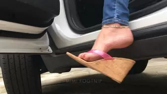 Mimi Revs & Strokes the Buick Encore in Wedge Cork Flip Flops with Pink Plastic Straps