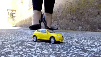 Crushing the yellow toy car