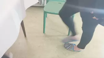 Dangling slipper from toes