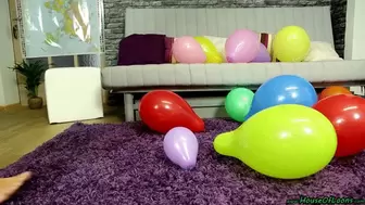 barefeet popping of party balloons