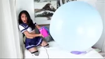 Schoolgirl Inflating large blue balloon non pop