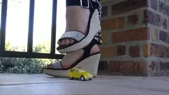 Natasha crushes a toy car and plays with her shoes