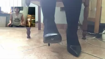toe tapping with high heels sitting in chair