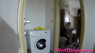 Desperate girl pee on the washing machine