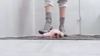 Sasha crushes raw chicken into pieces with ankle high heel boots