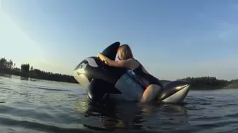 Alla hotly fucks a black inflatable whale on the river and gets an orgasm and falls into the water!!!