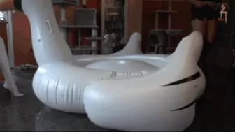 Big inflatable Swan under two pair of Boots