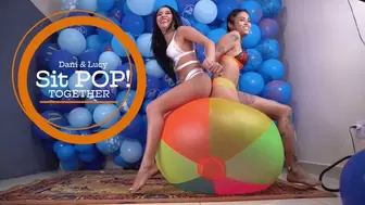 Two Girls Sit Pop Huge Beach Ball