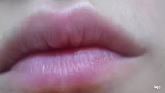 Putting pink lipstick on lips to cam mp4