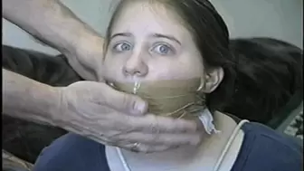 19 Yr OLD SCHOOL GIRL  IS MOUTH STUFFED, WRAP TAPE GAGGED, BAREFOOT & TOE TIED
