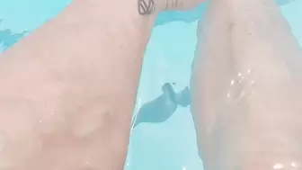 Tempest using phone to film calves while in pool