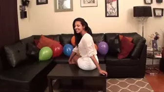 Latina Mandy sits on her balloons