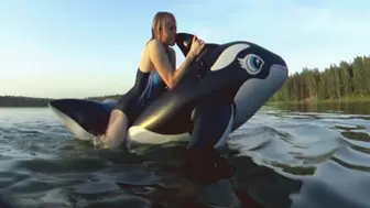 Alla is a hot rider on a black inflatable whale on the lake!!!