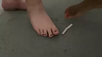 Two Goddesses stomping on cigarette barefoot