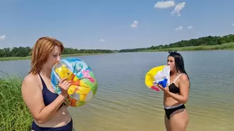 Girls inflate balls with their mouths