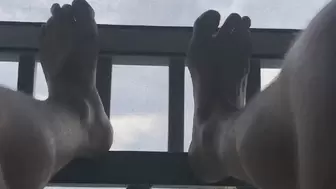 Man’s Feet Relaxing on the Porch
