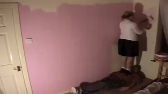 Lisa Paints The Wall Whilst Stood On Her Slave