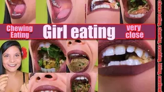 Girl Chew Pretty girl eats a sandwich with raw ham and very hard corn kernels that crack hard