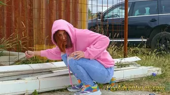 Girl with a hoodie pee trough her jeans