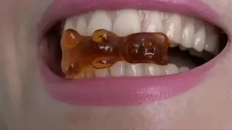 Show your sharp sharp teeth very close and bite gummy bears WMV FULL HD 108p
