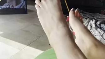 Dirty feet bouncing on huge exercise ball