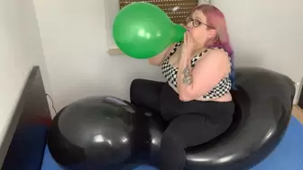 B2P sitting on a giant doll balloon