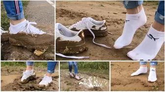 Muddy Puma sneakers and wet muddy socks deep mud walking