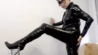 PVC catsuit and shiny boots posing