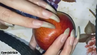 Clawing poor apple with nails