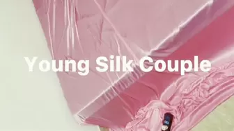 Girl tied on bed in shiny soft pink silk (Part 1)