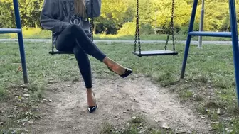 KIRA IS ON A PUBLIC PARK SWING IN HER HIGH HEELS - MOV Mobile Version