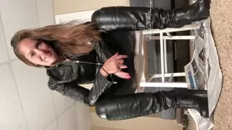 leather clad mistress has you bound at her feet- vertical video