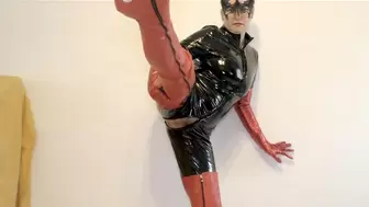 Catsuit with long red boots and red gloves posing