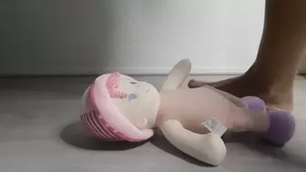 Sandra is trampling and crushing a doll