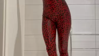 red leopard skin latex catsuit tease in bathroom