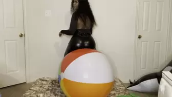 Ass bouncing on large beach ball before finger nail pop
