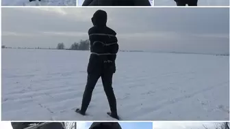 Snow walk in a down jacket and ropes
