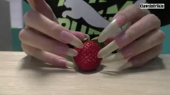Nails clawing strawberry