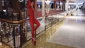 Red latex catsuit with high heels in public