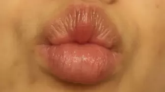 Aurora Puckers and Pulses Her Lips