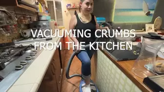 VACUUMING CRUMBS FROM THE KITCHEN