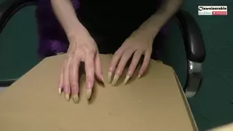 nails hard scratching cardboard box