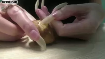 nails scratching an avocado pit