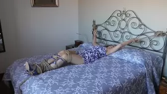 Ivy Blonde tied up to her bed
