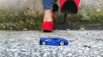 Trying my red high heels on lil toy car