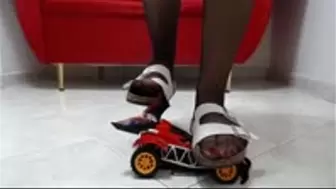 crush a toy car buggy in sexy sandals
