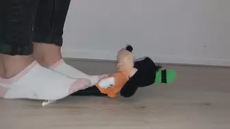 Sandra is dominating and trampling goofy into submission with socks on