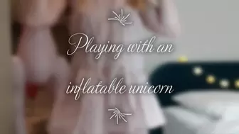 Playing with an inflatable unicorn