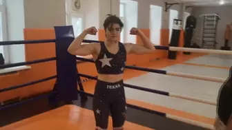 Thai boxer girl with big biceps wrestles hard